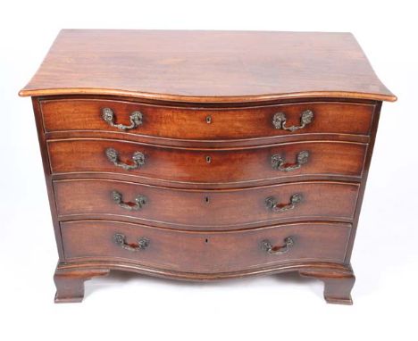 A GEORGE III MAHOGANY SERPENTINE FRONTED BATCHELOR'S DRESSING CHEST of four graduated drawers in the manor of Thomas Chippend