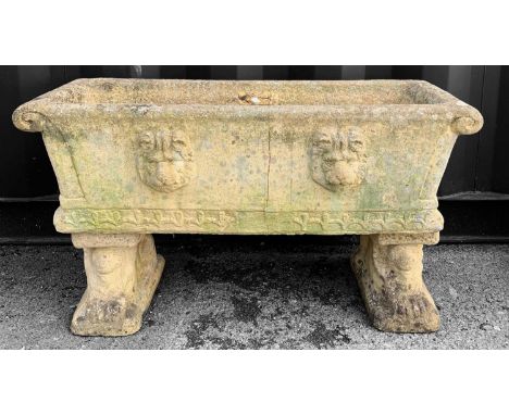 STONEWARE GARDEN FLOWER TROUGH, on twin lion supports and with four lion masks to the body, 90cms wide