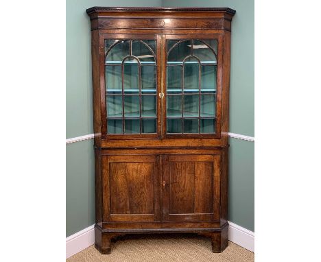 19TH CENTURY WELSH OAK STANDING CORNER CABINET, ropetwist moulded frieze with engraved ovals and circles, arched and reeded a