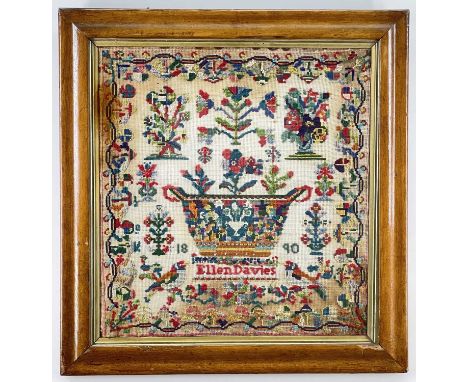 ELLEN DAVIES WOOLWORK SAMPLER 1890, in bright colours, with basin of flowers, further stems of flowers and parrots, 58 x 55cm
