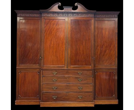 SUBSTANTIAL MAHOGANY ANTIQUE TRIPLE BREAK-FRONT WARDROBE circa 1900, centre two door linen press over four graduated drawers,