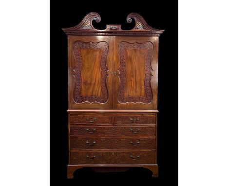 19TH CENTURY MAHOGANY LINEN PRESS, pierced swan neck pediment with central applied oval patera tablet above foliate and denti