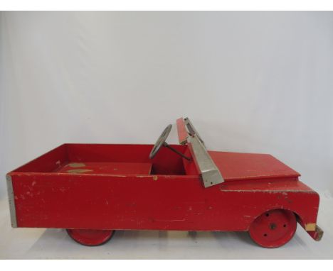 A scratch built out-of-scale Land Rover pedal car.