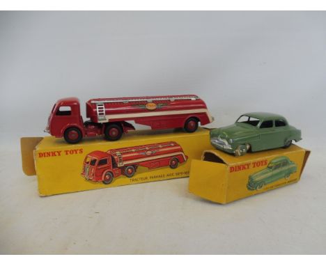 Two original boxed Dinky Toys: a 24U Simca and a Panhard AVEC Semi Esso, box end flap detached and tatty. 