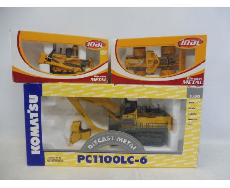 A 1/50th scale Komat-su construction vehicle, PC1100LC and two Joel diggers.