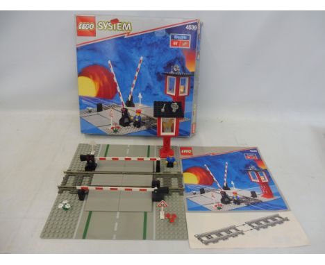 A boxed Lego 4539 9v Manual Level Crossing set, unchecked. 