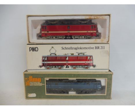 Two boxed diesel engines, the first a Lima 8027 and the second a Piko BR211.
