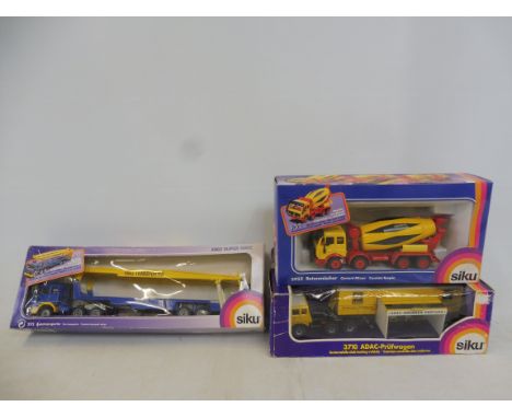 Siku boxed die-cast construction models including an auto transporter and an Automobile Club testing vehicle etc. (3).