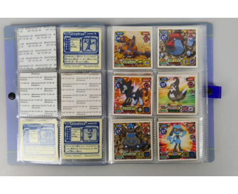 Pokemon - An album containing approximately 38 Pokemon stickers from various series including Diamond & Pearl, Daiichi Pan Br