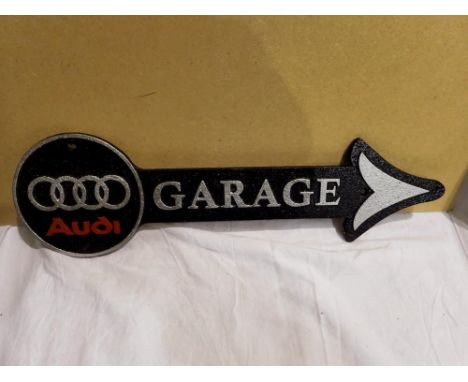 Cast iron Audi garage arrow. W: 40 cm. UK P&amp;P Group 1 (£16+VAT for the first lot and £2+VAT for subsequent lots) 