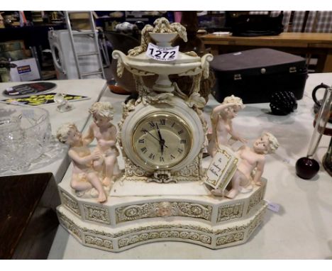 Academy Collection resin mantle clock with cherub figures. Not available for in-house P&amp;P 