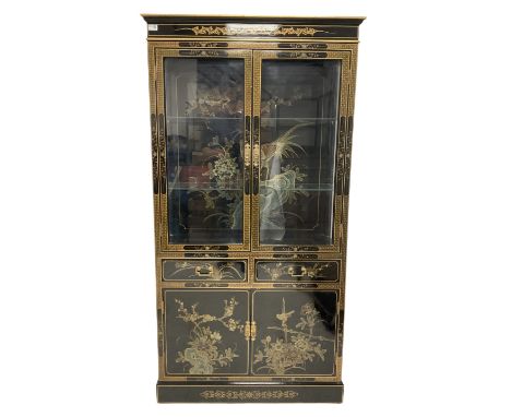 Chinese black lacquered and gilded display cabinet, fitted with two glazed doors, opening to reveal two adjustable glass shel