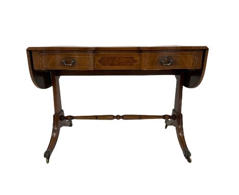 20th century quality mahogany sofa table, the drop leaf top over three frieze drawers, raised on four splayed supports, termi