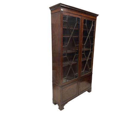 19th century mahogany glazed cabinet, the dental cornice over two glazed doors of astragal design, opening to reveal four adj