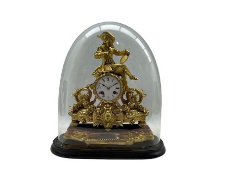 A French gilt spelter striking mantle clock housed under a glass dome c 1880, decorative gilt case on a padded wooden plinth 