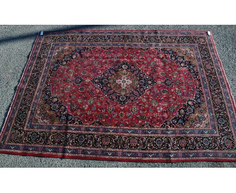 A fine hand made and very attractive Kashan Carpet, Central Persia, the madder field of scrolling vines, flower heads and pal