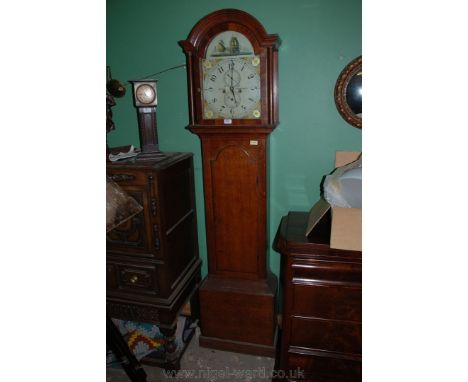 A Georgian Oak country Long Cased Clock.  Arch top hood with turned columns flanking the Mahogany cross-banded arch top. Glaz