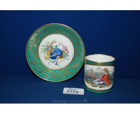 A pretty continental Cup and Saucer, with green borders having gilt highlights, the cup oval panel decorated with young boy s