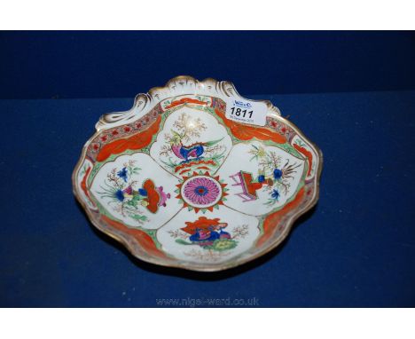 A Worcester shell shaped shrimp dish brightly decorated with the Dragon in Compartments/Bengal Tiger design, c.1765-70. A sma