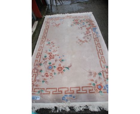 A fawn ground Oriental Carpet, 58'' x 103''