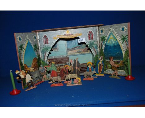 A wooden painted Christmas Nativity box with light carved wooden figures and animals, manger, etc.
