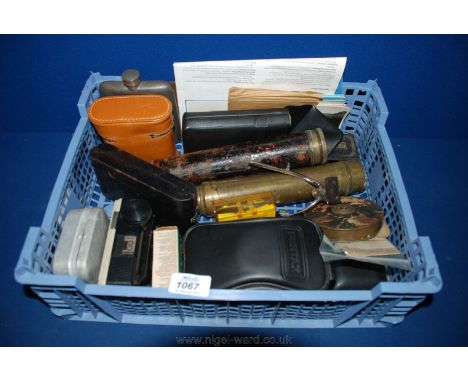 A box of miscellanea including old Kodak Camera, Instamatic Camera, Hip Flask, brass Telescope, Remington Razor, Travel Alarm