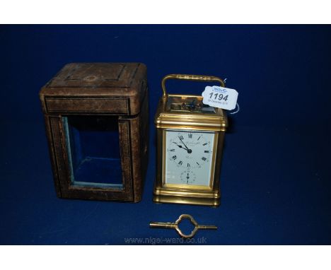 A superb French Brass Carriage Clock with key in original case, by Charles Frodsham & Co. No. 20057, Paris.  5 1/4'' tall x 3