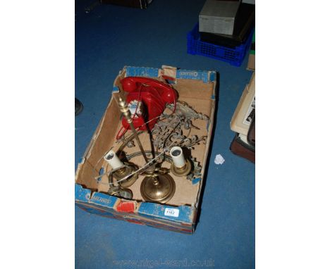A quantity of decorative metal wall light fittings, double fitting desk light and red telephone.