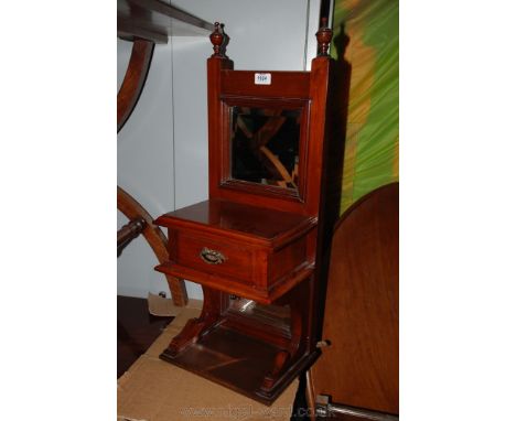 A circa 1900 Walnut table top Vanity Unit having twin finial top over moulded framed square, bevel plated mirror over shelf w