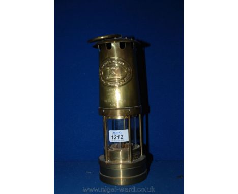 A brass Miner's Lamp by E. Thomas & Williams Ltd., made in Wales and engraved 'Always a Star Memphis from the Silver Dollar C