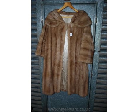 A ladies light brown Fur full length Coat, medium