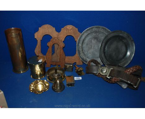 A quantity of WWI Brass memorabilia including trench art shells, leather belts and Pewter plates, etc.