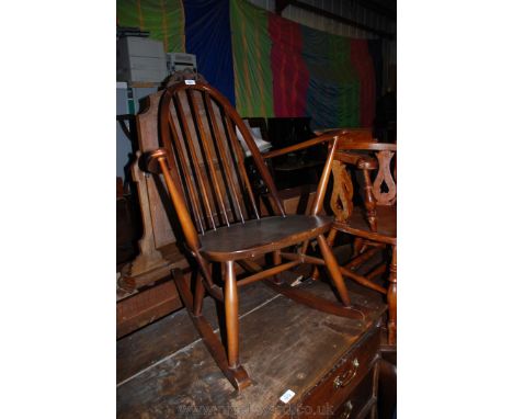 A modern Oak Shaker style Rocking Chair, stick back, flat arms, shaped seat and turned legs