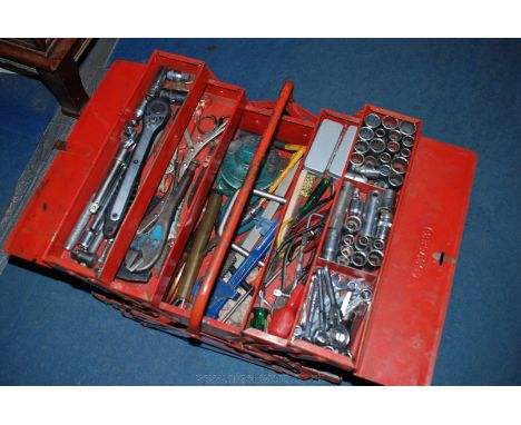 A very heavy cantilever action steel toolbox on castor wheels containing a large quantity of tools including several "Mole" t