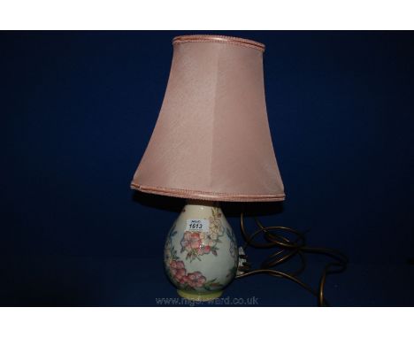 A Moorcroft Lamp with pink shade  