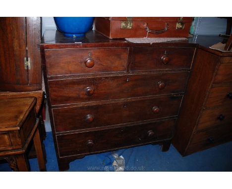 A 19th c. Mahogany chest of two short over three long graduated drawers, having rectangular top over the five cock beaded and