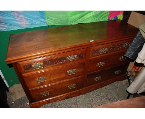 A modern Walnut finished Sideboard having rectangular moulded edge top over two flights of three drawers, the top drawers hav