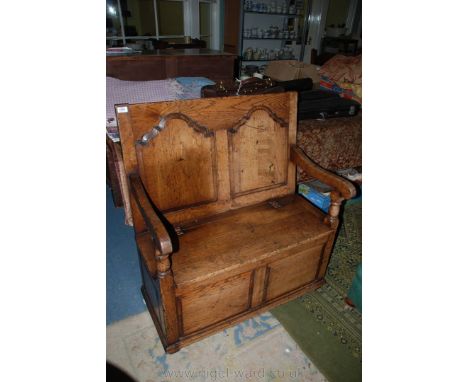 A superb quality reproduction Oak Bench Seat of traditional construction, having plain top over twin, raised and fielded shap
