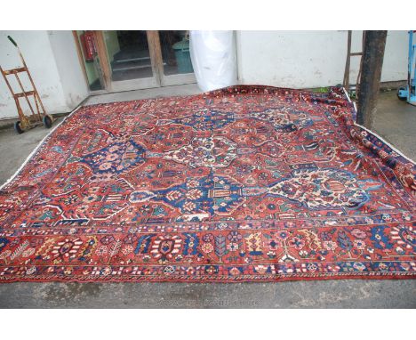 An antique Heriz Carpet, 380cm x 333cm