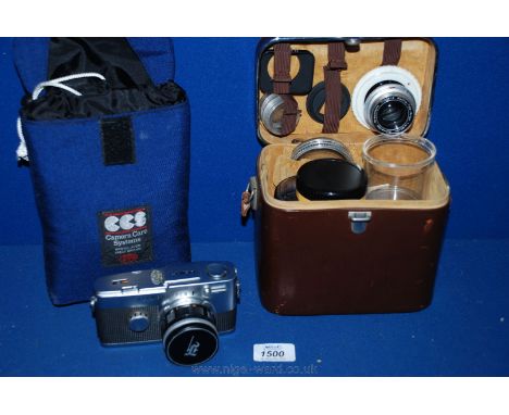 An Olympus - Pen F Camera in blue waterproof case, along with  Kodak Retina accessories case complete with a Schneider Kreuzn