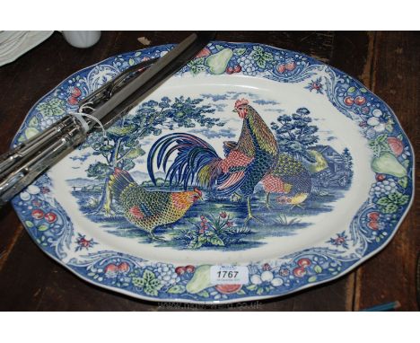 An unmarked Meat Platter with cock and hen decoration to the central panel and pears and cherries to the rim together with a 