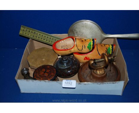 A box of miscellanea including a pair of Clogs, hand Mirror, Treen Trinket Box and lid, Nutcracker, folding Measure, etc.
