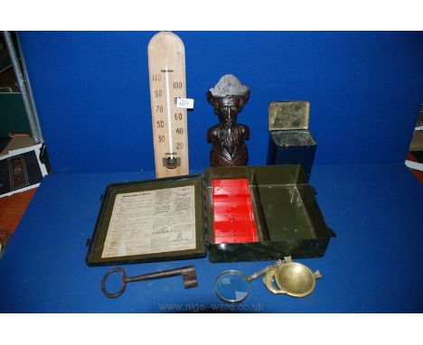 A quantity of miscellanea including an old First Aid Tin, carved figure of a bearded Gent, Thermometer, large old Key, brass 