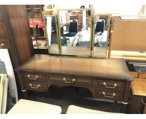 A mid 20th century teak dressing table with mirror, stools and two matching side drawers and a matching seven drawer chest ap