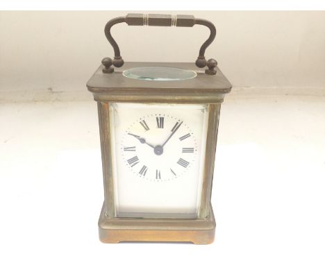A Brass Carriage Clock. Approx height 15 cm x 8 cm.