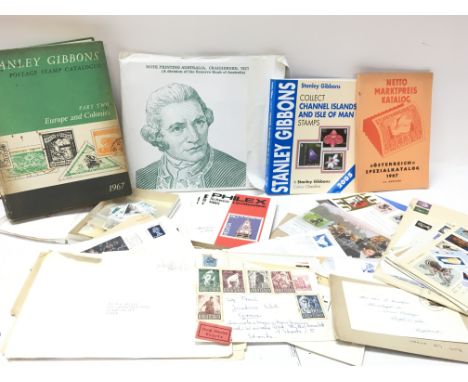 A collection of stamp related items including Stanley Gibbons Europe and Colonies part two, envelopes, first day covers etc. 