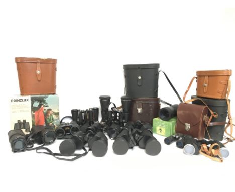 A large collection of vintage binoculars, some cased. Including Carl Veitch 10x50, Prinzlux 10x50, Boots Empire made 80x30, P