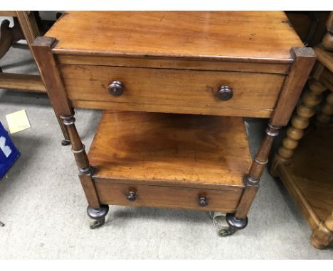 A Victorian side table fitted with two drawers on turned legs .