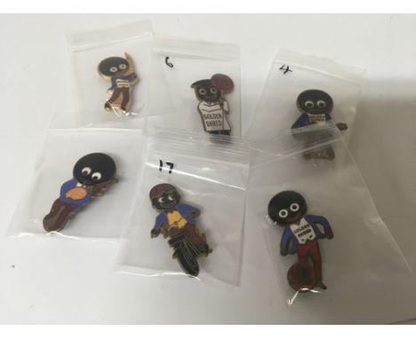 A collection of six Vintage enamel Golly badges including the lollipop man (6)- NO RESERVE