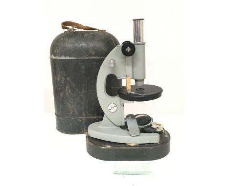 A cased vintage Russian microscope. Approximately 35cm tall. Postage category D
